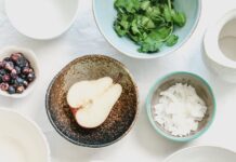 운동과 건강한 식습관의 결합 An overhead shot of fruits, seeds and spices in bowls