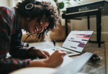 몸과 마음의 균형을 맞추는 생활 습관 woman in black and white striped long sleeve shirt writing on white paper