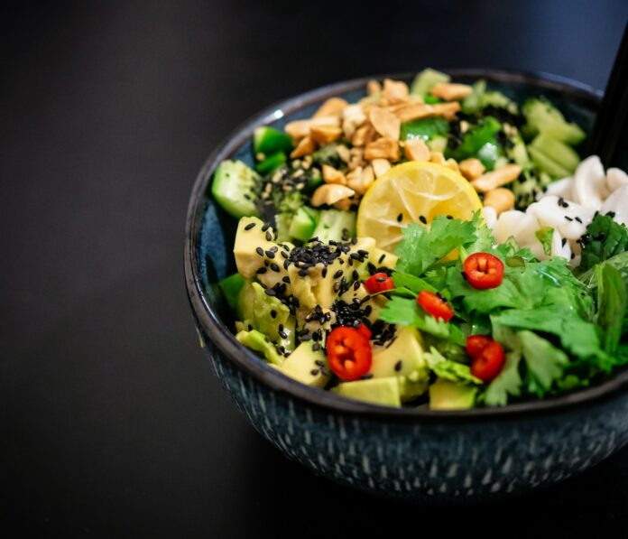 Photo by Yoav Aziz vegetable salad in gray bowl